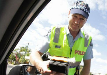 A police office writing a ticket